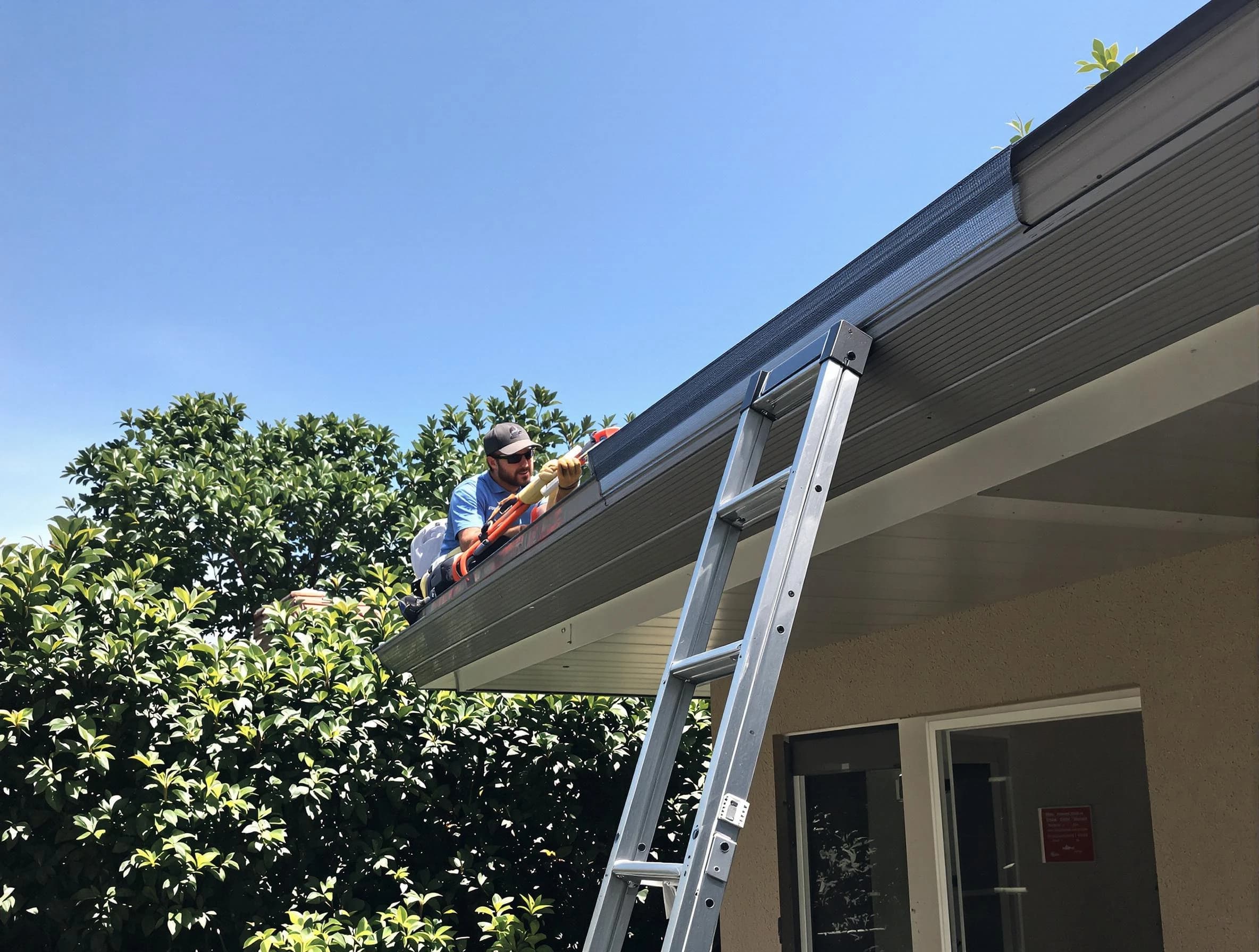 Maple Heights Roofing Company installing gutter guards for a homeowner in Maple Heights, OH